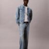 Trucker Jacket em Denim dos anos 90 com Monogram em toda a peça Trucker Jacket em Denim dos anos 90 com Monogram em toda a peça